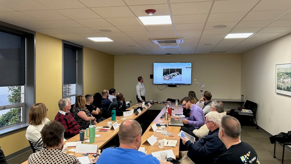 Lou Sabo shows one of his photos on a screen in front of the NRG group.