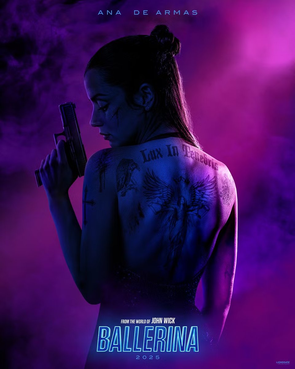 A very blue and purple-toned poster for "Ballerina" that depicts Ana de Armas from behind, showing off a full back tattoo that reads: "Lux in Tenebris". She is also holding a pistol, in case there was confusion about what kind of movie this is