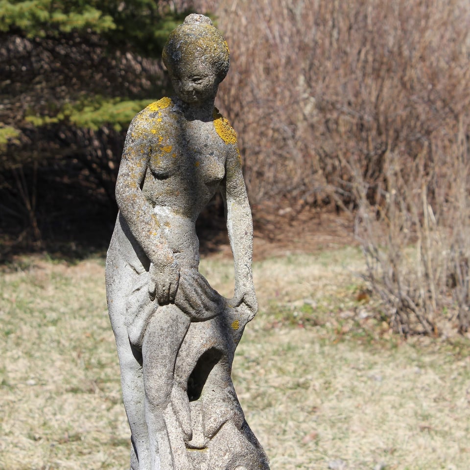 Stone statue in the spring