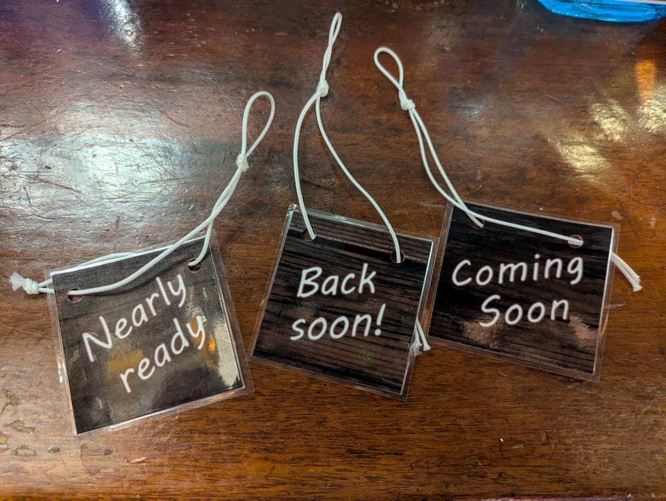 Pump clip labels saying "nearly ready" "back soon" and "coming soon"