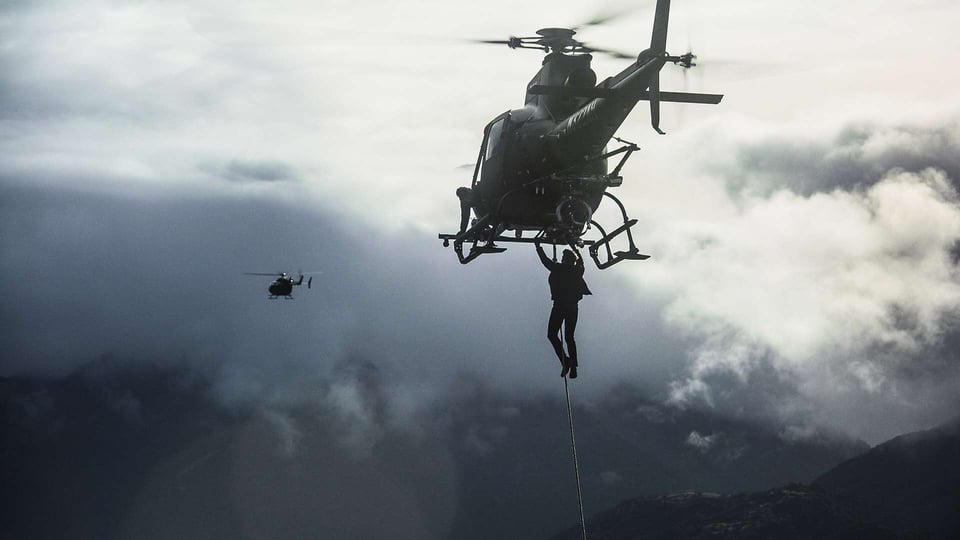 Tom Cruise dangling from an helicopter.