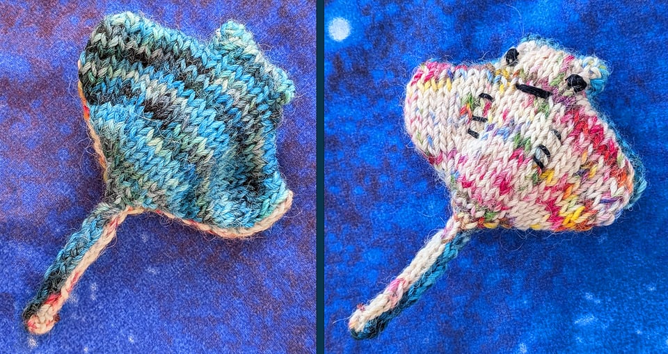 a tiny stingray knitted from a variegated blues-and-teals yarn, with a belly that is a creamy white with confetti spots of pinks, yellows, greens, and blues. It has a little smiling face and a line of gills, and it's adorable.