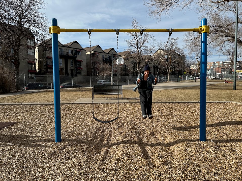 A woman on a swing.
