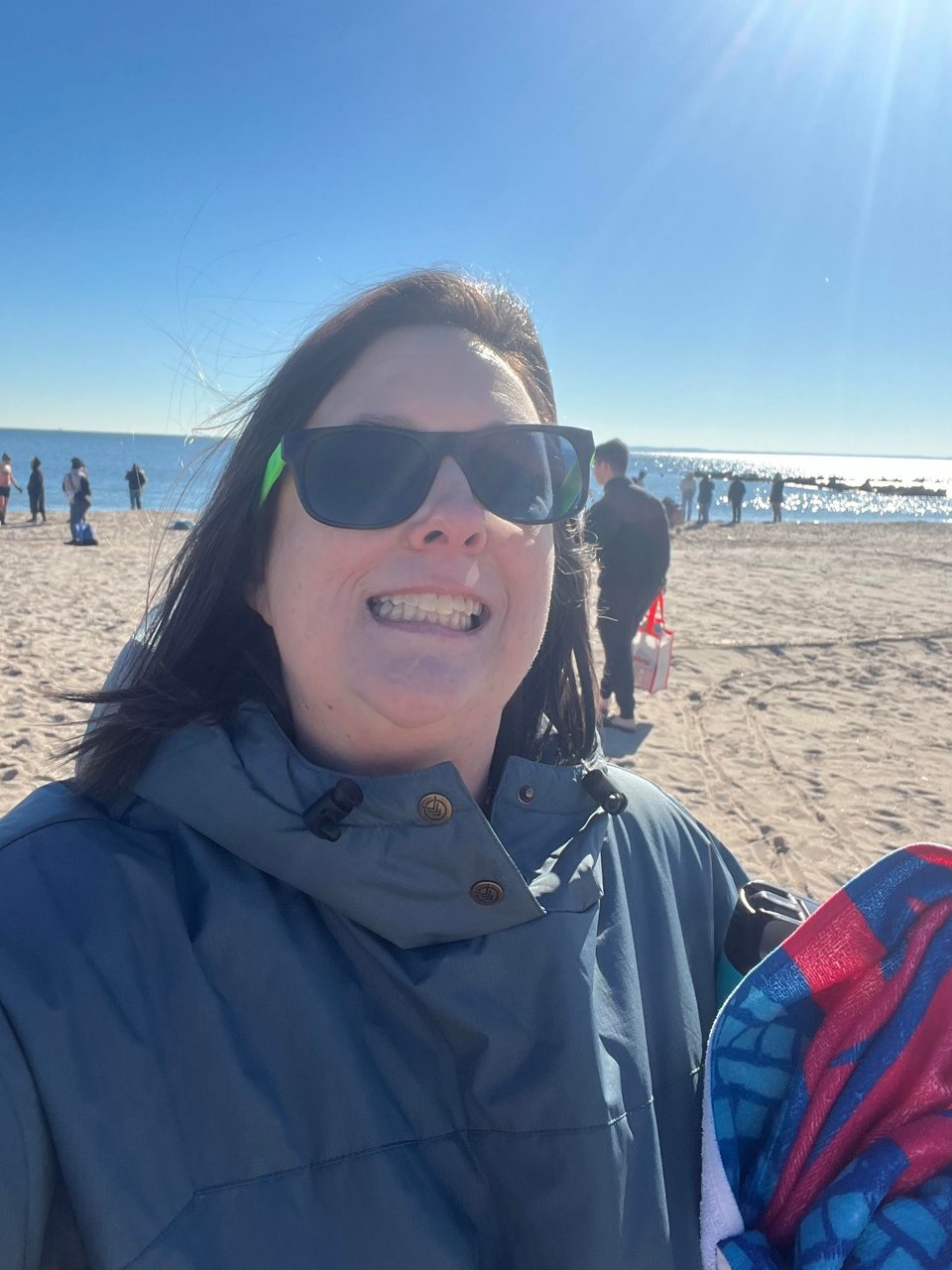 I'm in the robe on the beach, wearing sunglasses, and bent backward, holding my towel.