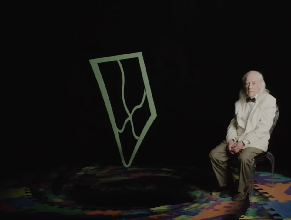 an old man sitting on a chair