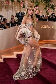 Jennifer Lawrence at the Golden Globes in a Givenchy gown strategically embroidered with flowers