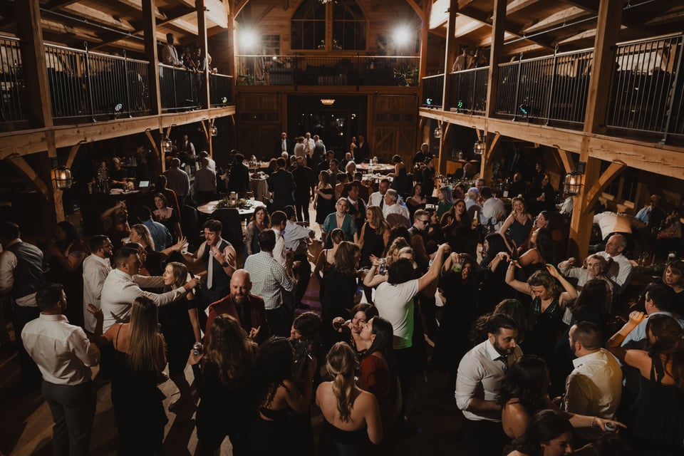 a large wedding reception at a barn