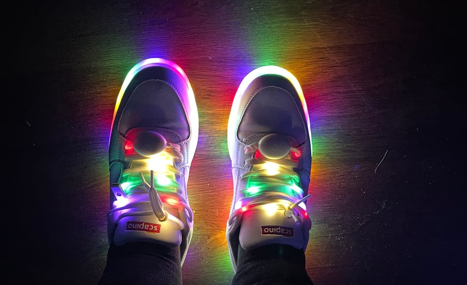 Glowing shoelaces and the rims around the edges of the sneakers