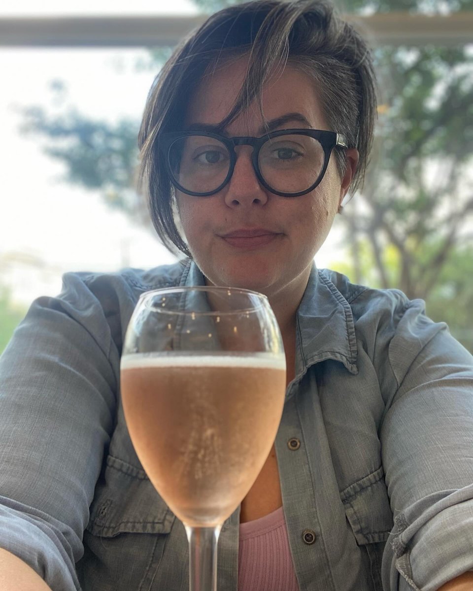 image description: a selfie Katy took earlier this month with a glass of wine