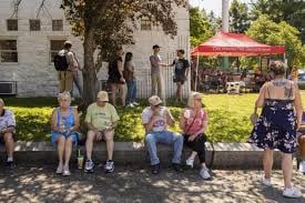 Sand shaking hands with voters at the Iowa State Fair