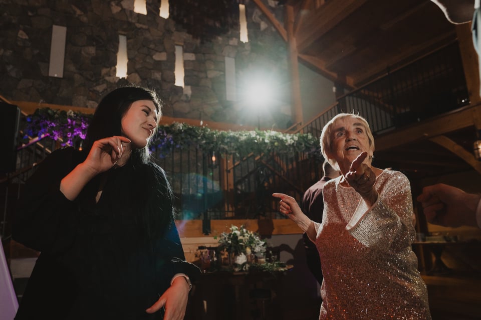 two people dancing at a wedding reception