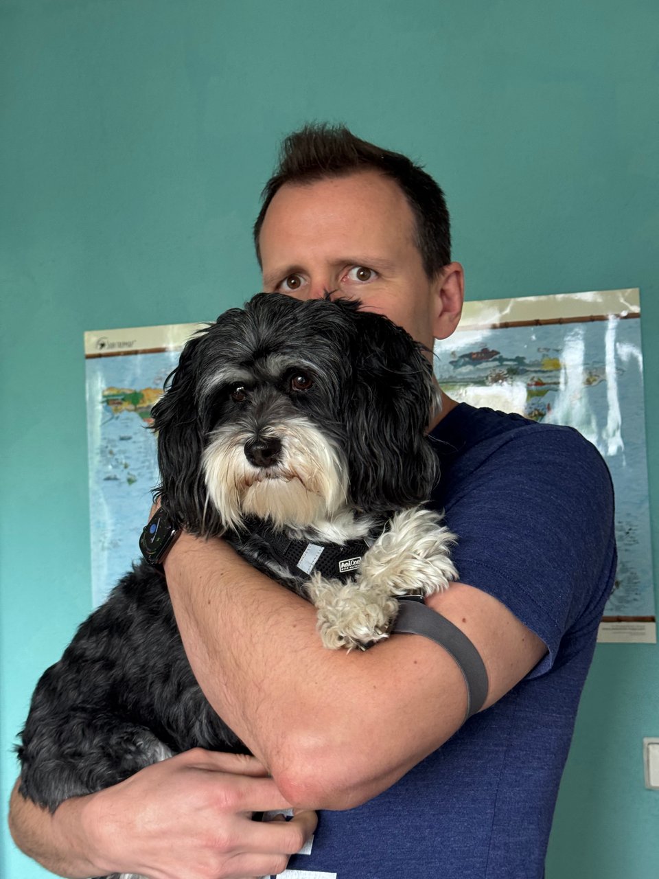 Me holding a distracted small dog.