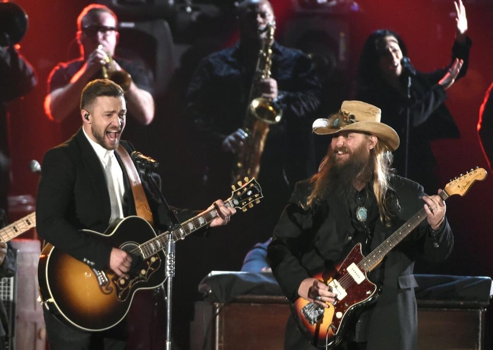 A photograph of the 2015 Country Music Awards, where Justin Timberlake (left) and Chris Stapleton (right) are performing together.