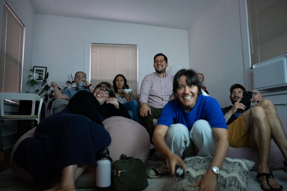 A room of people about to watch TV.