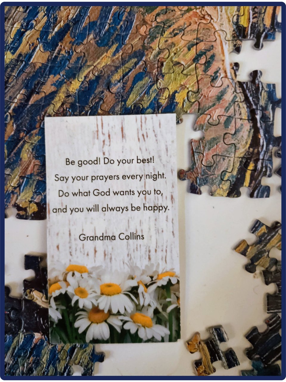 a photo of the back of a memorial card with white daisies along the bottom edge, and the quote “Be good! Do your best! Say your prayers every night, do what God wants you to, and you’ll always be happy.” - Grandma Collins" written on it.