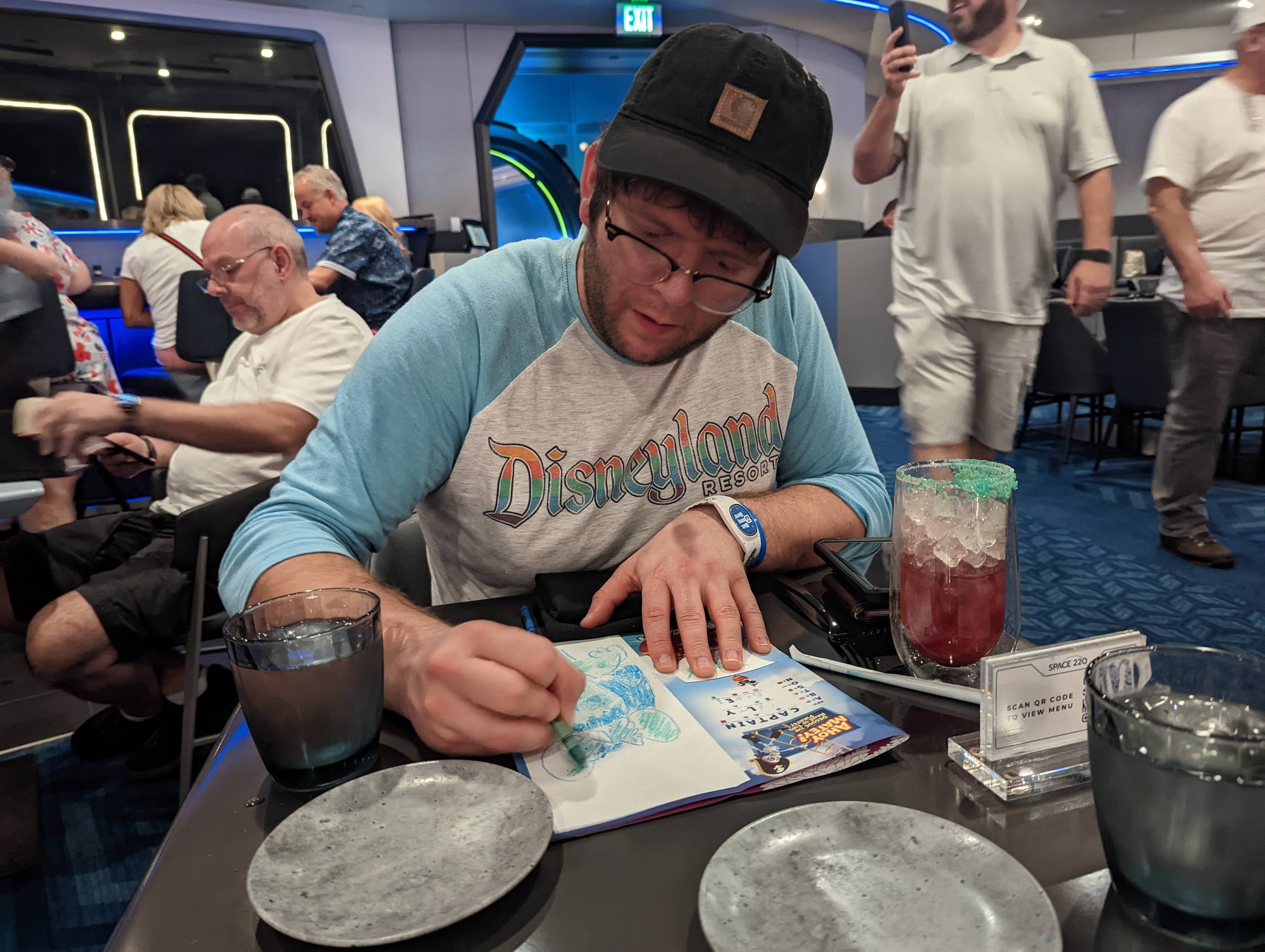 Ryan enjoys his cocktail and coloring pages at Space 220