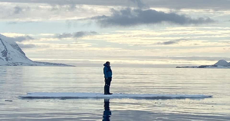 A person (Gael) standing on top of an ice floe