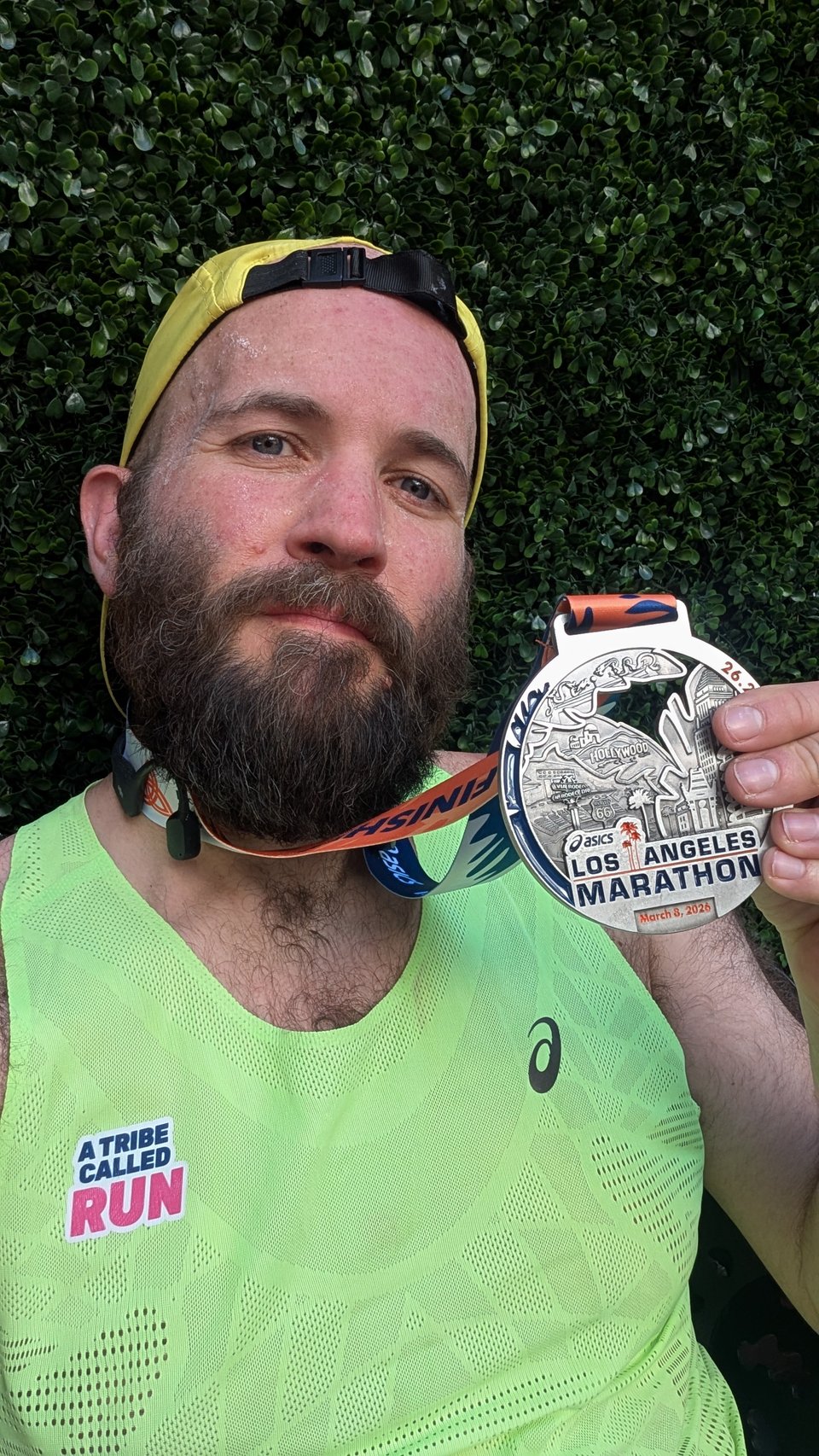 Me holding up my finisher's medal.