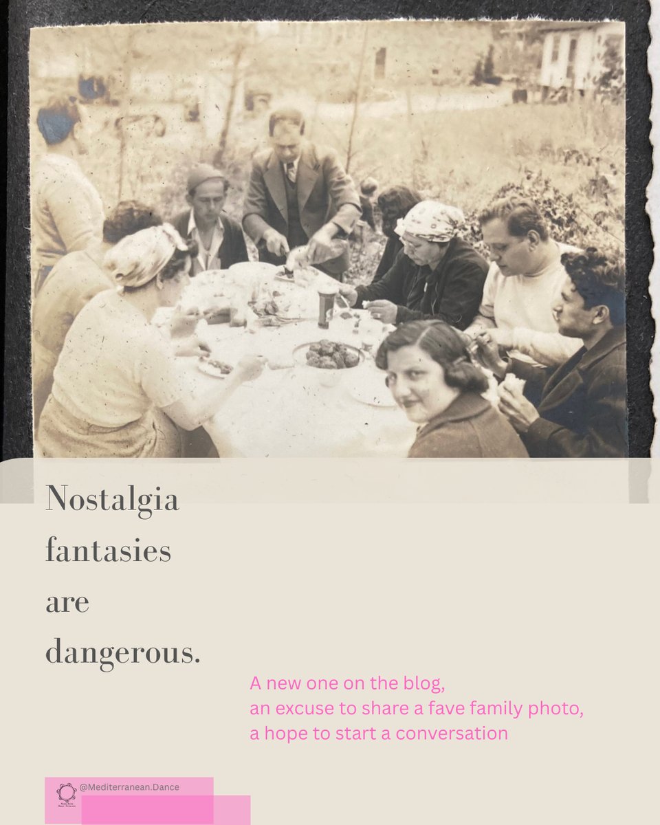 Photo description: Black and white photo of a group of people sit at an outdoor table eating. One looks directly at the camera.
