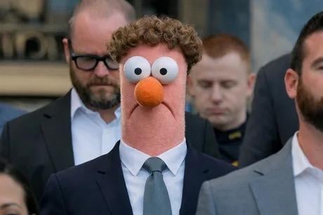 Mark Zuckerberg, photographed walking with men in suits, except his head is replaced by Beeker from the Muppets