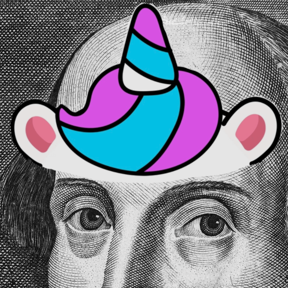 A close up image of a Shakespeare portrait, showing his eyes and forehead. A cartoon unicorn horn, purple and blue hair and cutesie ears are superimposed upon his brow