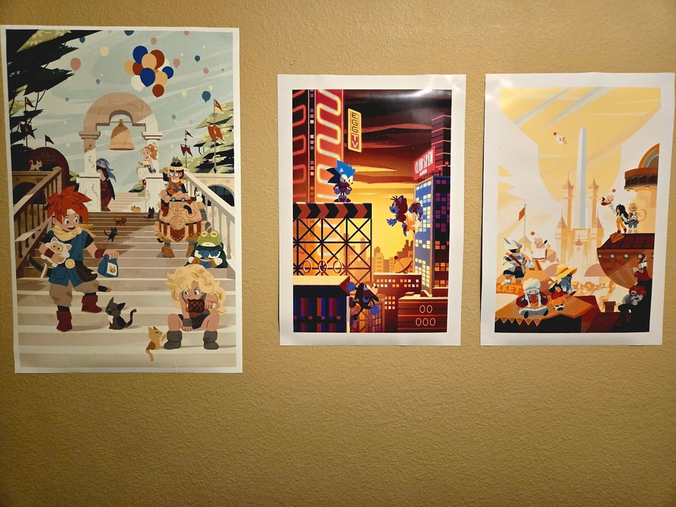 Picture of prints from artist oxfruit. One of chrono trigger, one of sonic, one of Final Fantasy IX
