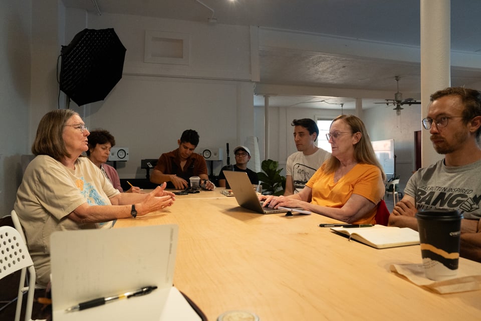 A group talking around a table.
