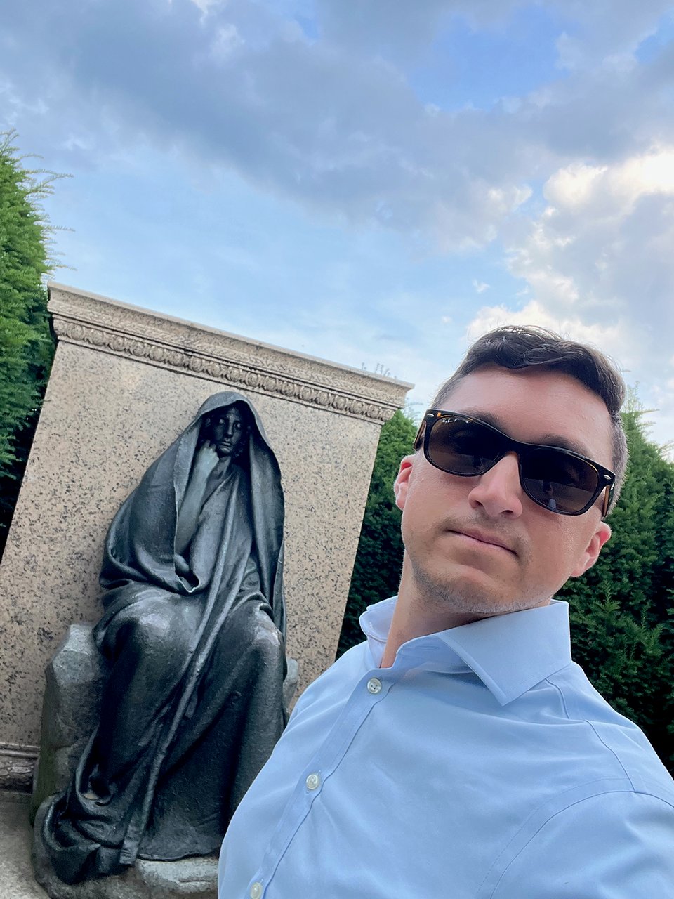 a man standing in front of a statue