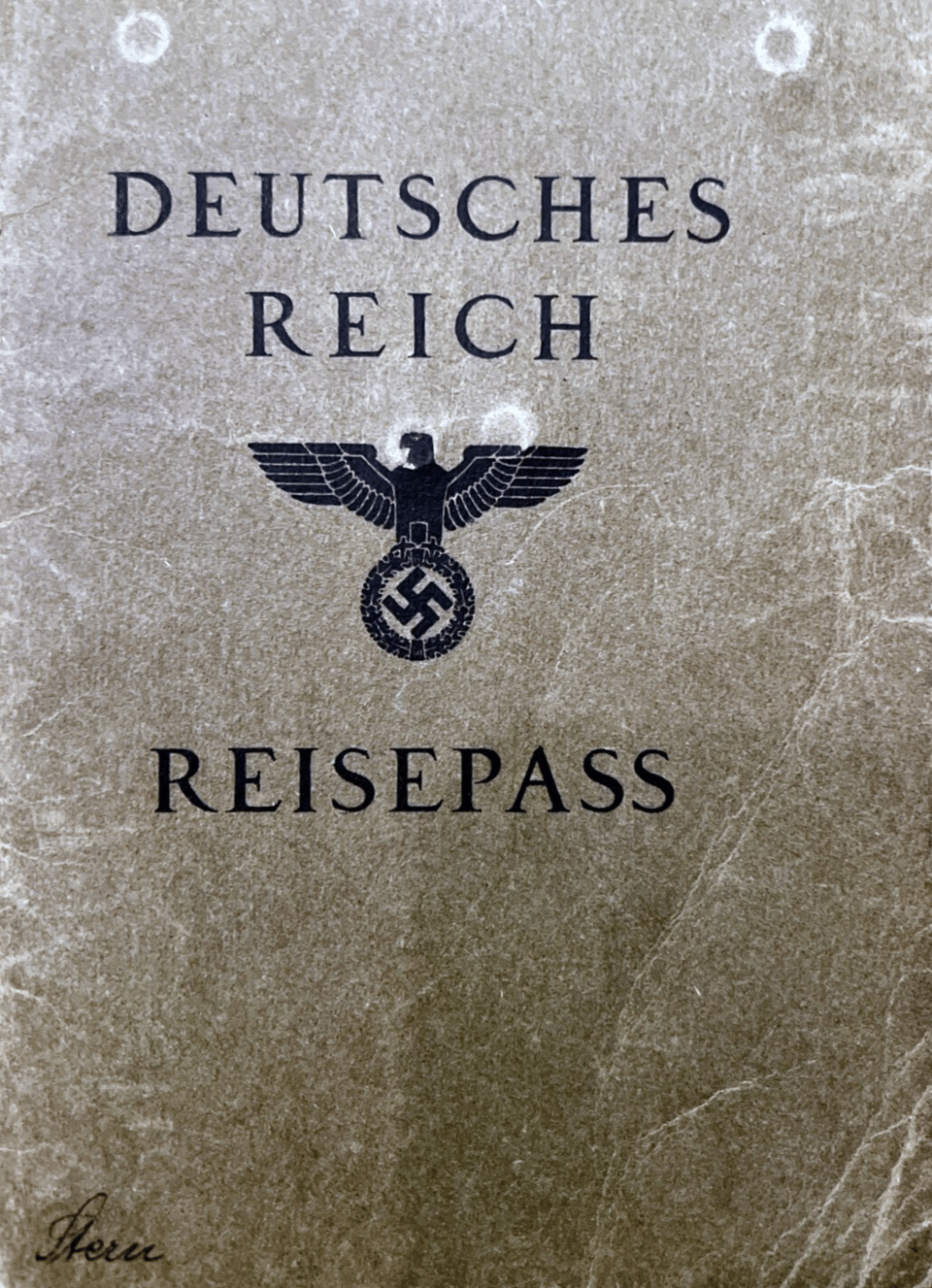 The cover of an old passport with the German words REICH REISEPASS