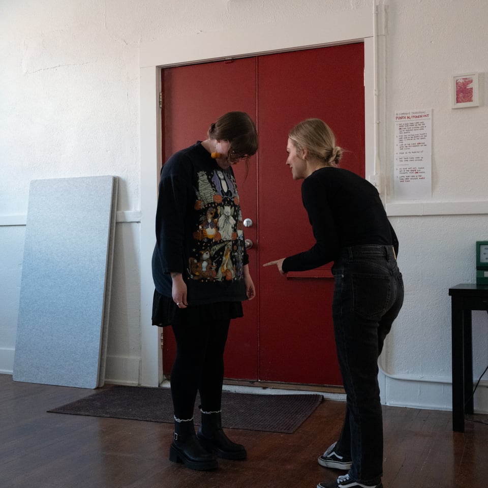 Halie admiring a Lizzie’s sweater.