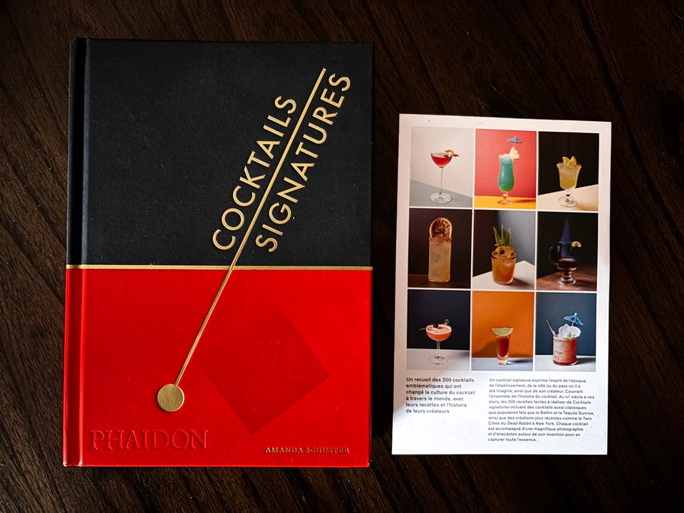 Front copy of Signature Cocktails book by Amanda Schuster next to back preview insert.