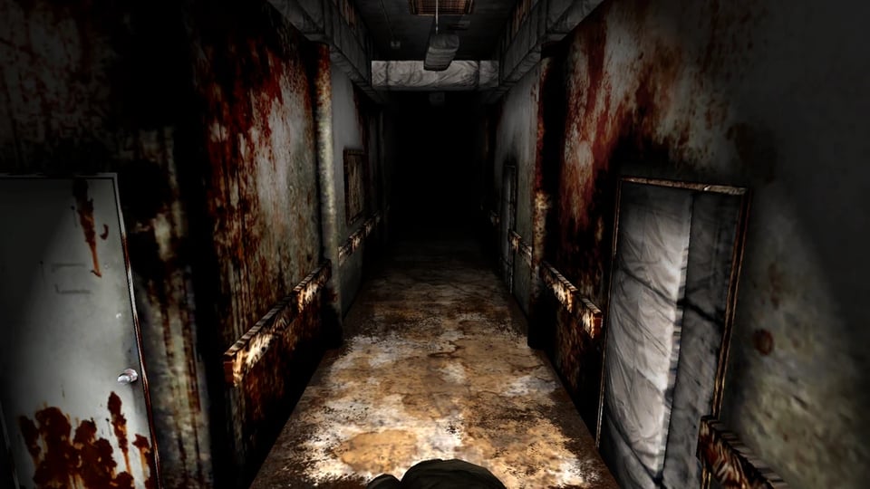 A rusted, rotten hallway with dirtied floors and bloodied walls as James enters the Other World