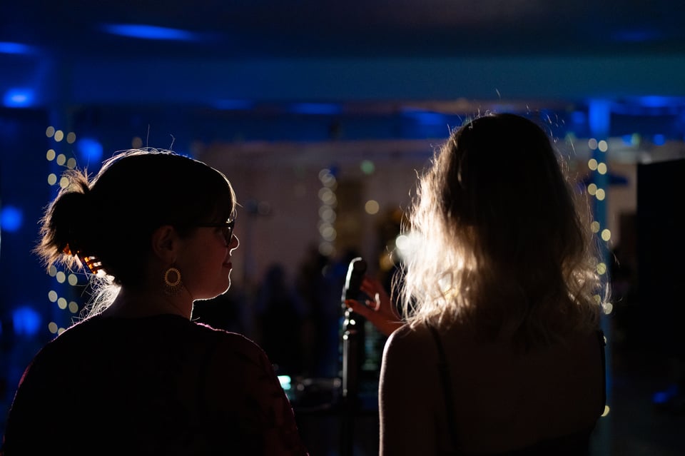 Lizzie and Halie making some remarks.
