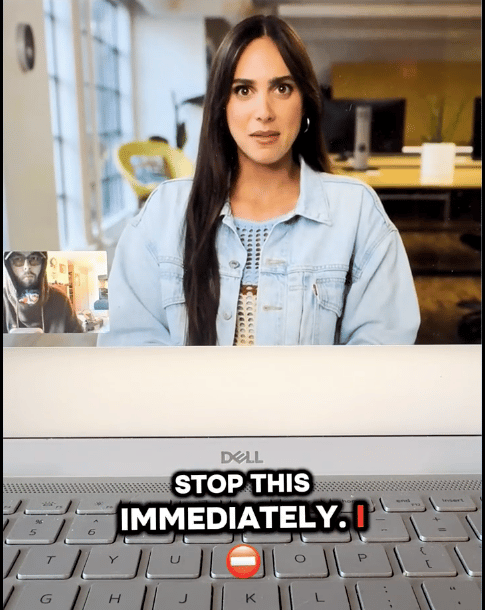 AI-generated human-like avatar scowls at a human on a videochat. In the foreground is a keyboard with the caption overlayed, "STOP THIS IMMEDIATELY."