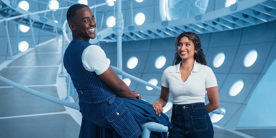 The Doctor and his new companion hang around the TARDIS laughing.