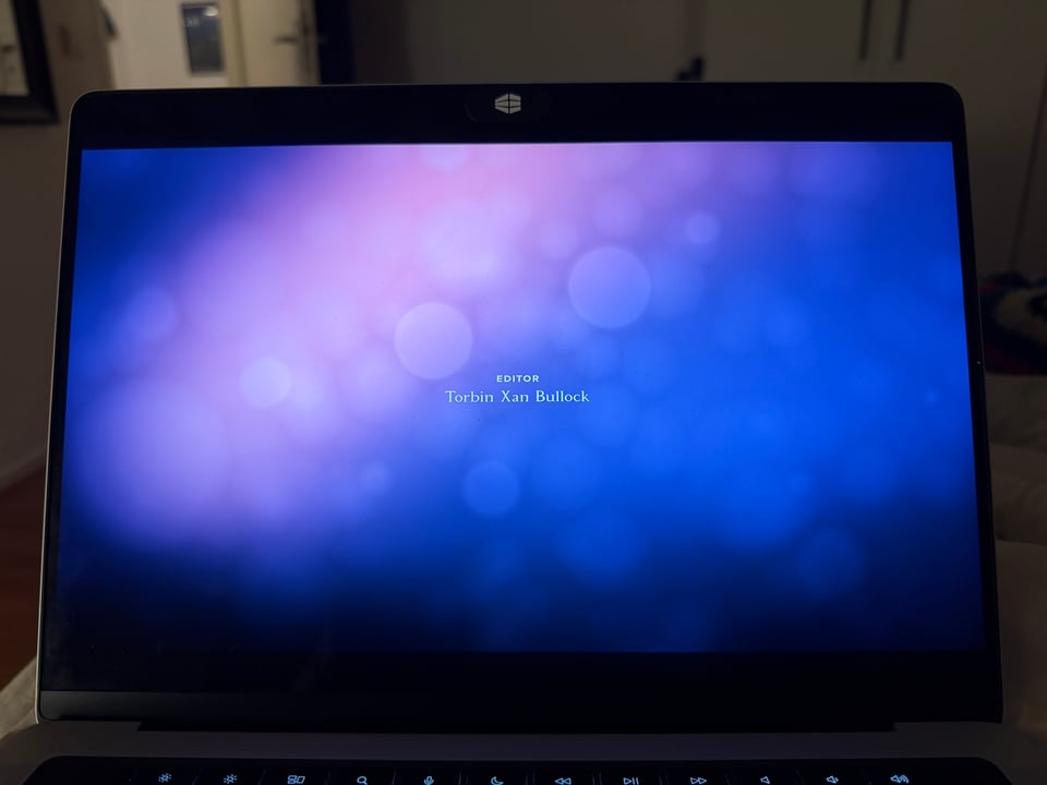 A computer screen shows the credit "Editor Torbin Xan Bullock" for the animated series WONDLA.