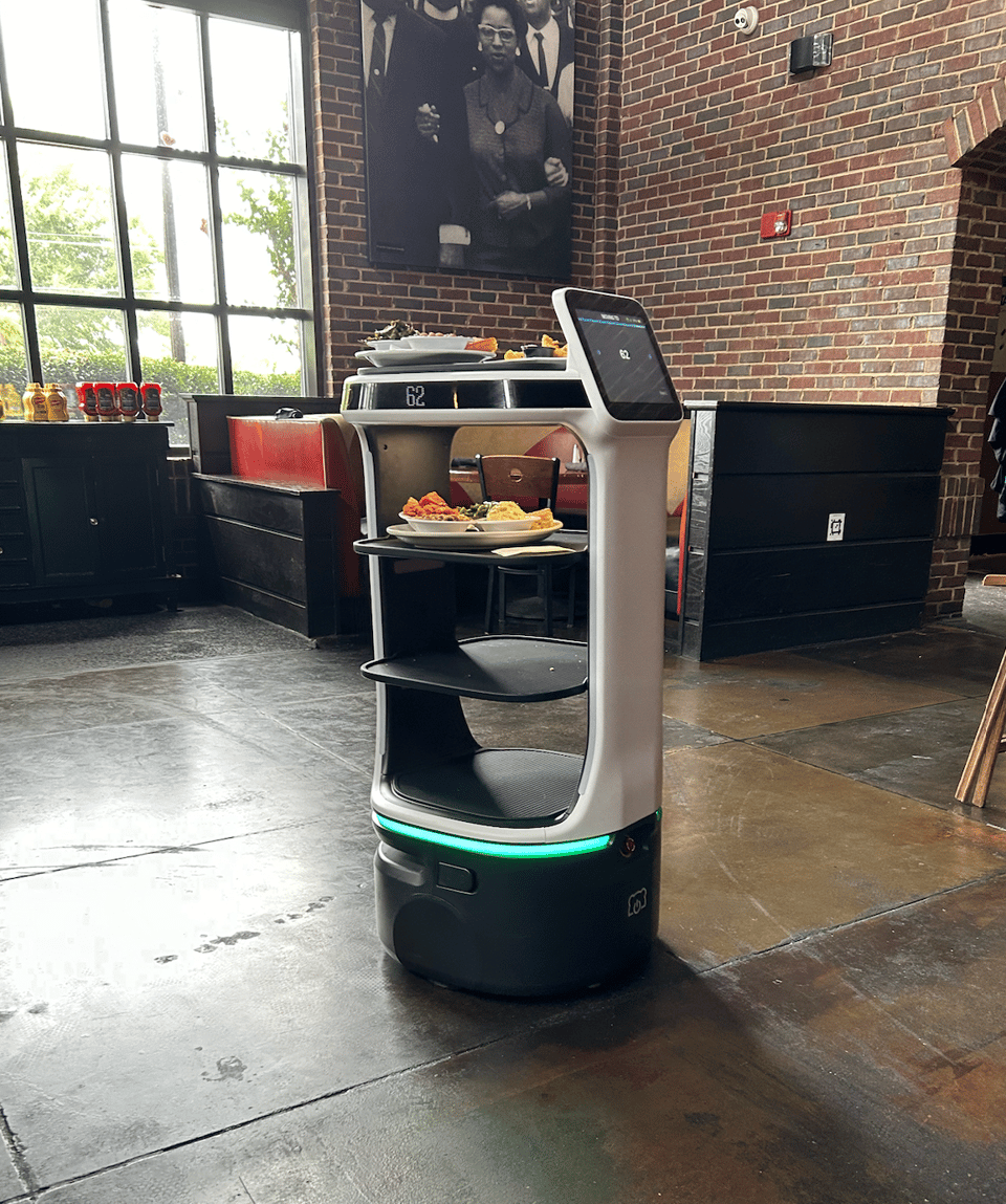 A robotic tray holder used to deliver plates to customers tables