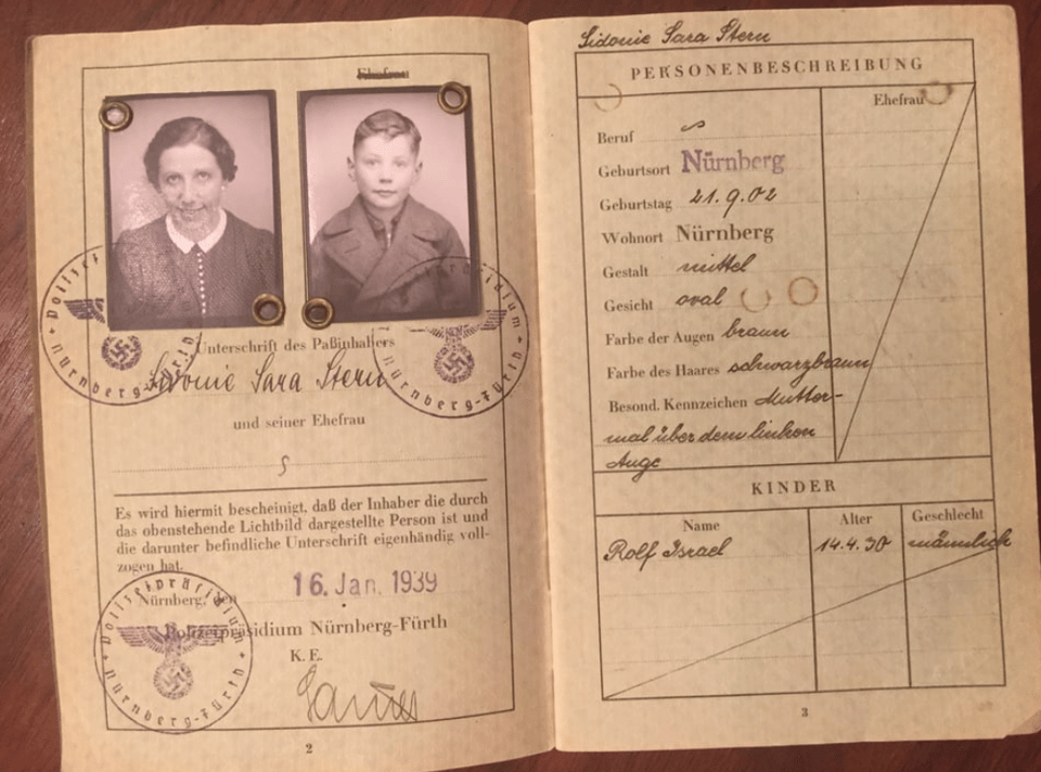 Passport with photos of a woman and a 9-year-old boy, with German print and handwriting, and stamps that include swastikas