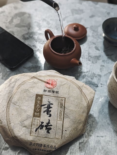 water pouring into chinese tea pot