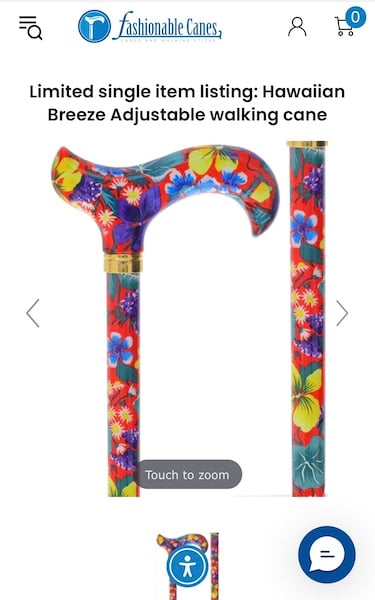 Red floral print cane with blue, yellow, teal and purple flowers