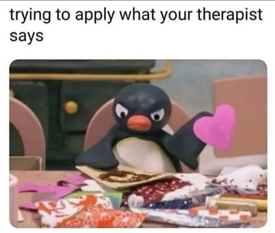An angry clay penguin making valentine’s day crafts. Above it is text that says, “trying to apply what your therapist says”