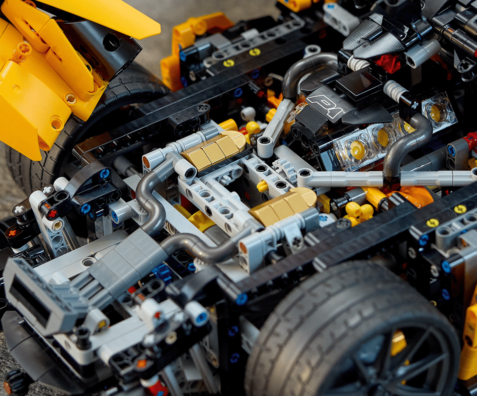 The 7-speed gearbox of an orange LEGO Technic Ultimate McLaren P1