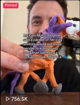 a screenshot from tiktok of Dave parading a clay sculpture