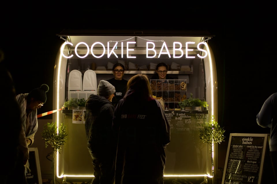 Two women buy Cookie Babes cookies
