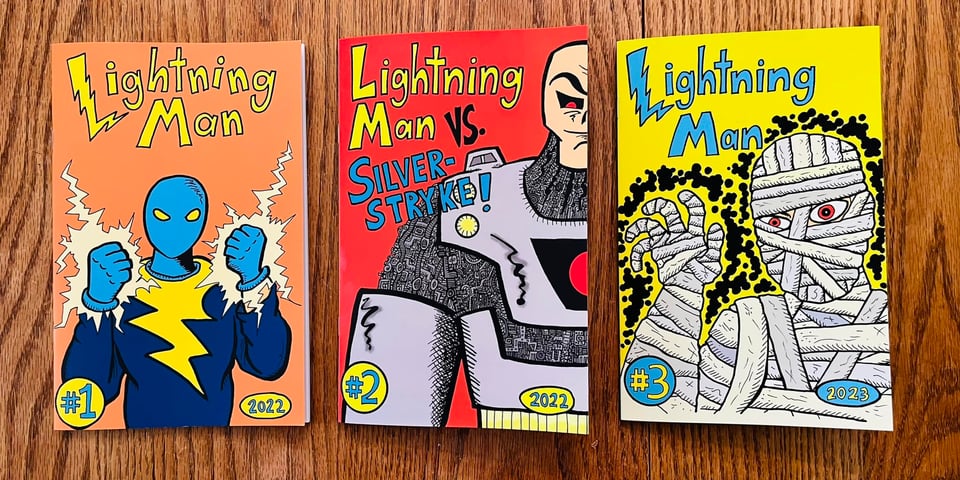 Lightning Man #1-3 on a table