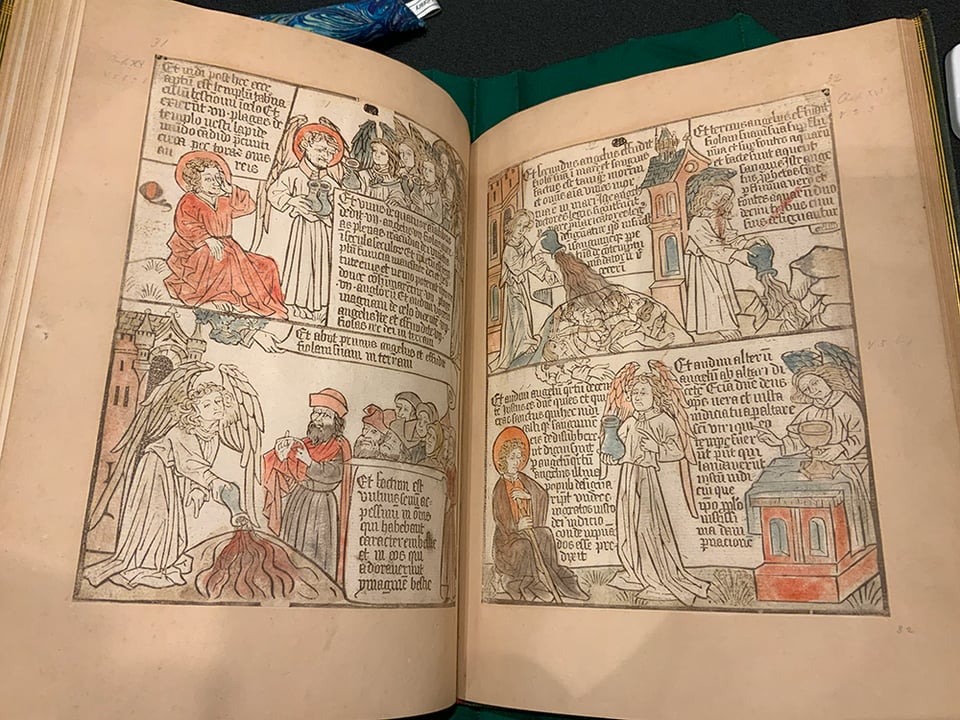 A woodblock-printed book from the 15th century, showing angel and humans interacting.