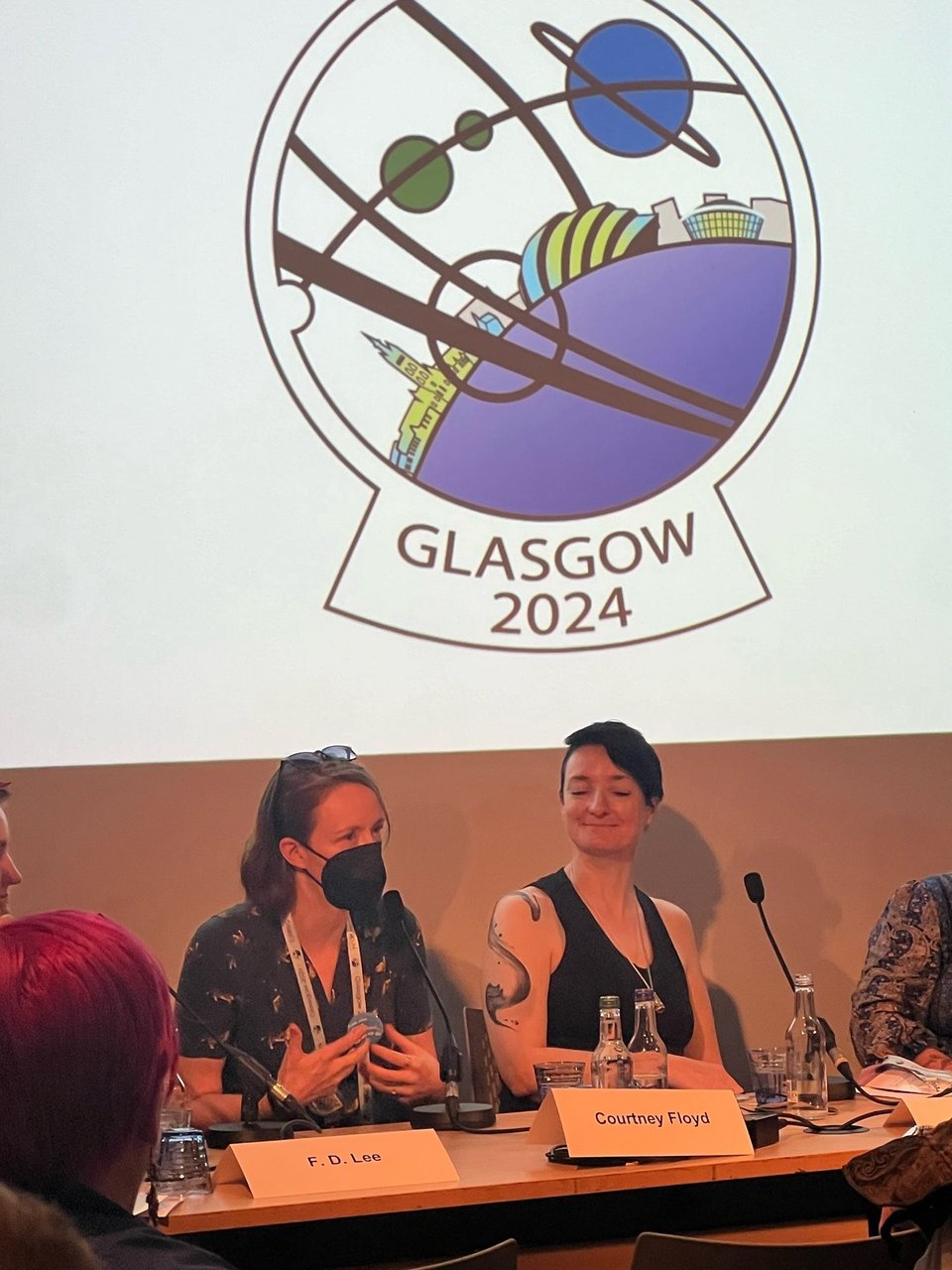 Me in a dress and mask, on the Dark Academia: The Lure of Evil Institutions panel at WorldCon