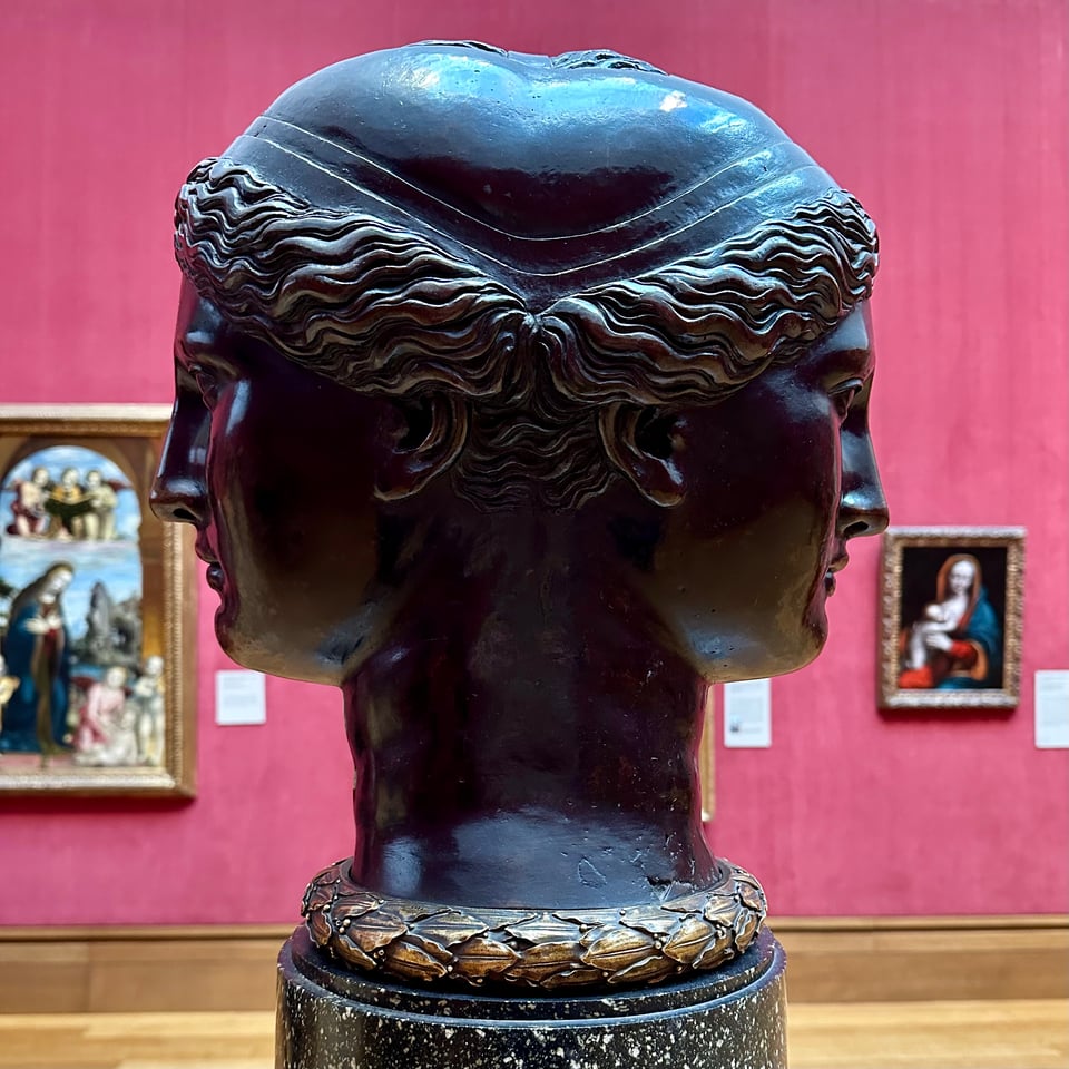 Photo of a double-headed sculpture, attributed to Francesco Primaticcio. It is a bronze, and both heads have wavy hair and a cap that merges with the opposite head.