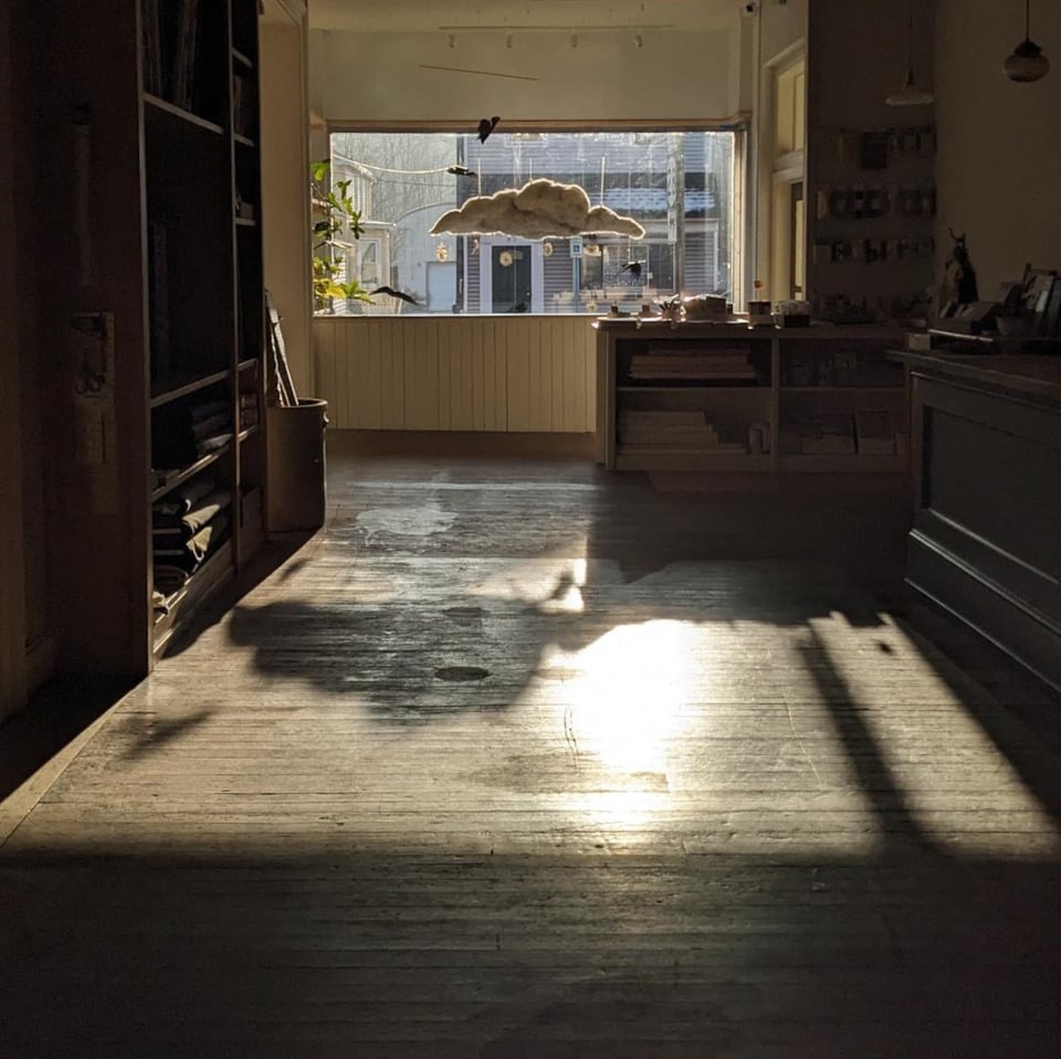 sun shining through felted cloud into art store