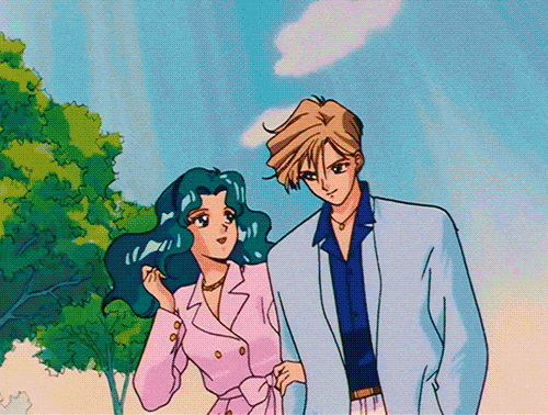 An animated GIF of two characters from the anime series "Sailor Moon" with their arms interlocked. Sailor Neptune on the left, Sailor Uranus on the right.